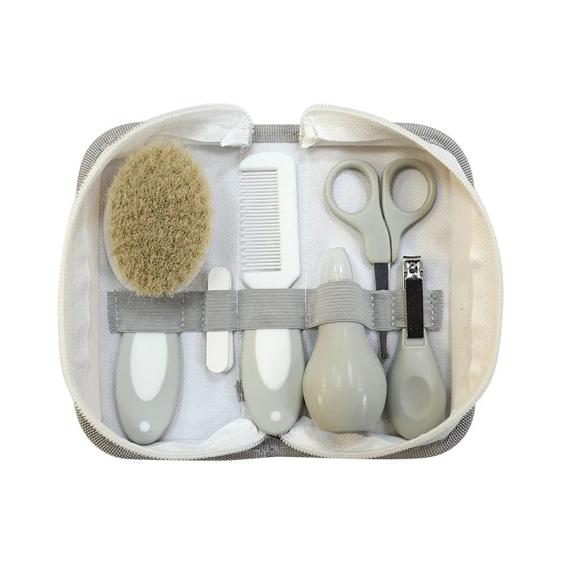 6-in-1 Baby Grooming Set with nail clipper, scissors, soft brush, comb, nasal inhaler, and nail file in a compact travel case.