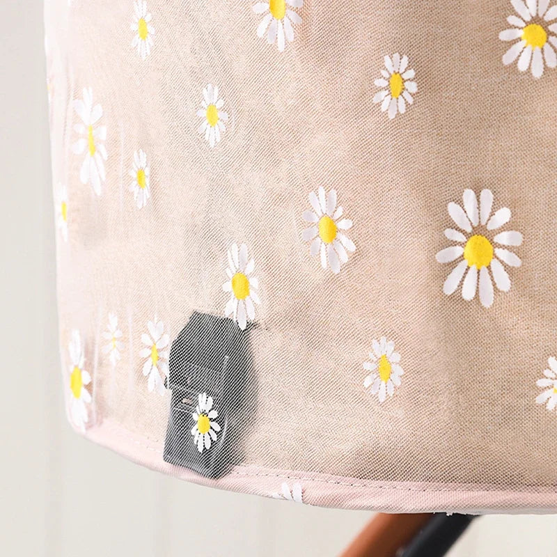 Baby stroller sunshade and bug net with floral pattern, providing mosquito protection and UV sunshade for toddlers.