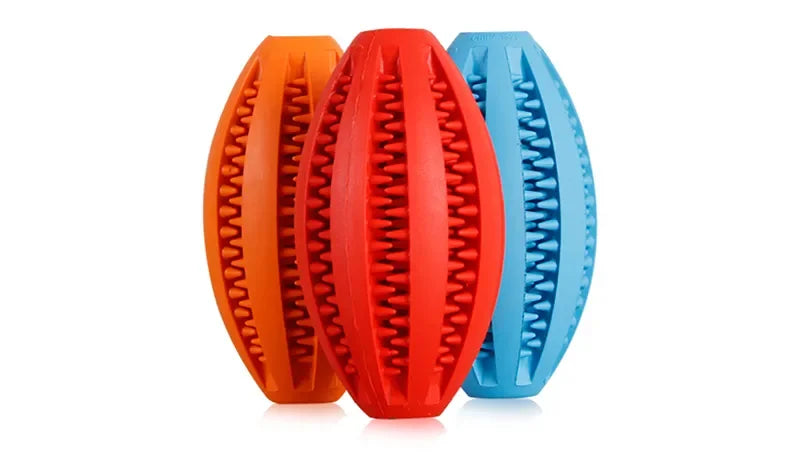 Colorful natural rubber chew balls for dogs, designed to clean teeth and hold treats. Durable and non-toxic dog toy.