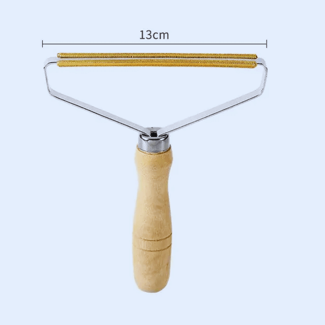 Manual portable pet hair and lint remover brush with wooden handle for clothes and furniture, 13cm width.
