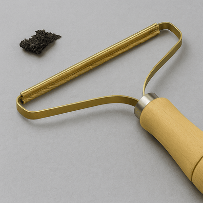 Portable Pet Hair & Lint Remover – Manual Brush for Clothes and Furniture on display with wooden handle and metal frame.