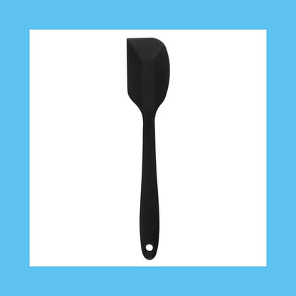 Black silicone spatula isolated on blue background