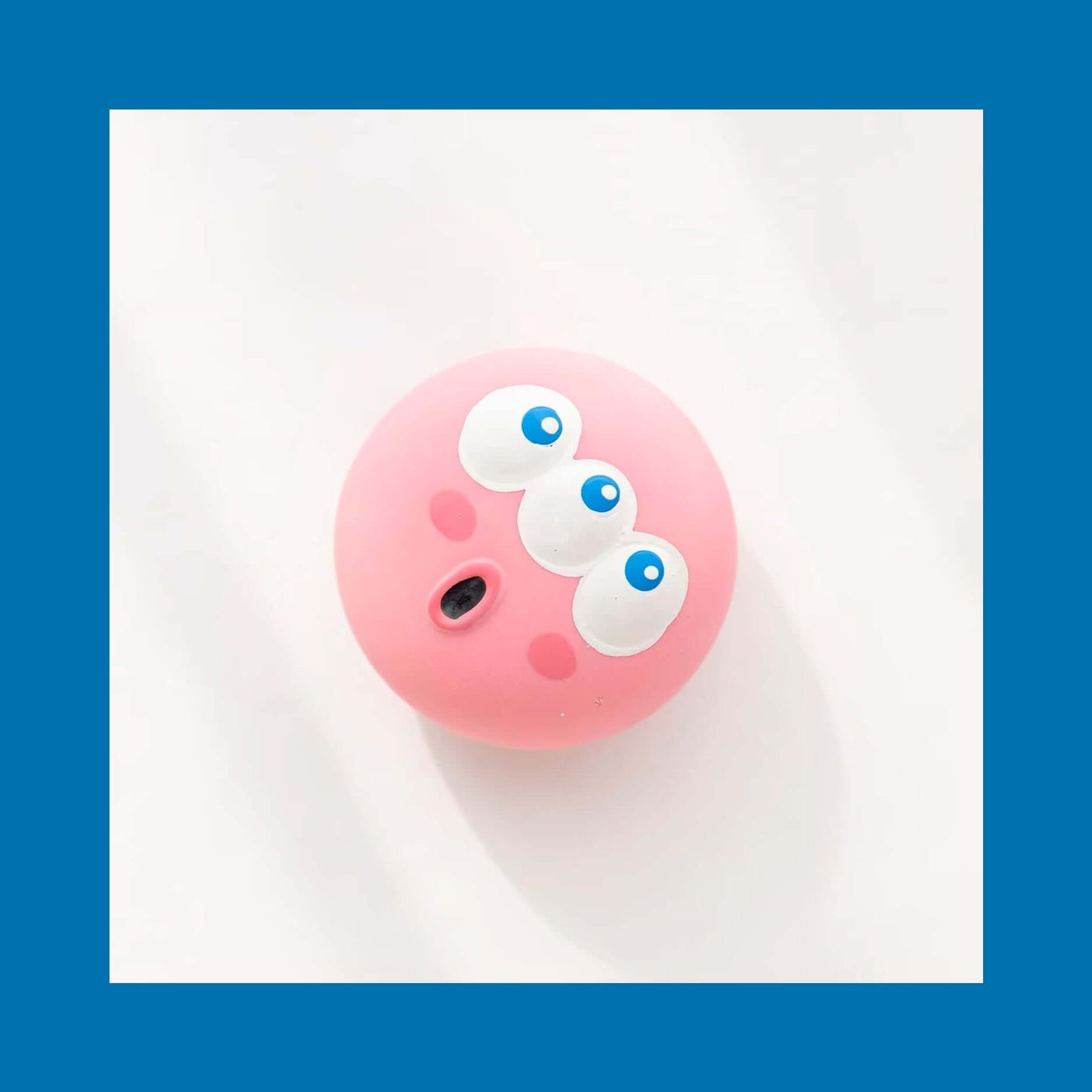 Squeaky Eyeball Dog Toy in pink with engaging squeaky sound, perfect for training and small breeds, made from durable, non-toxic materials.