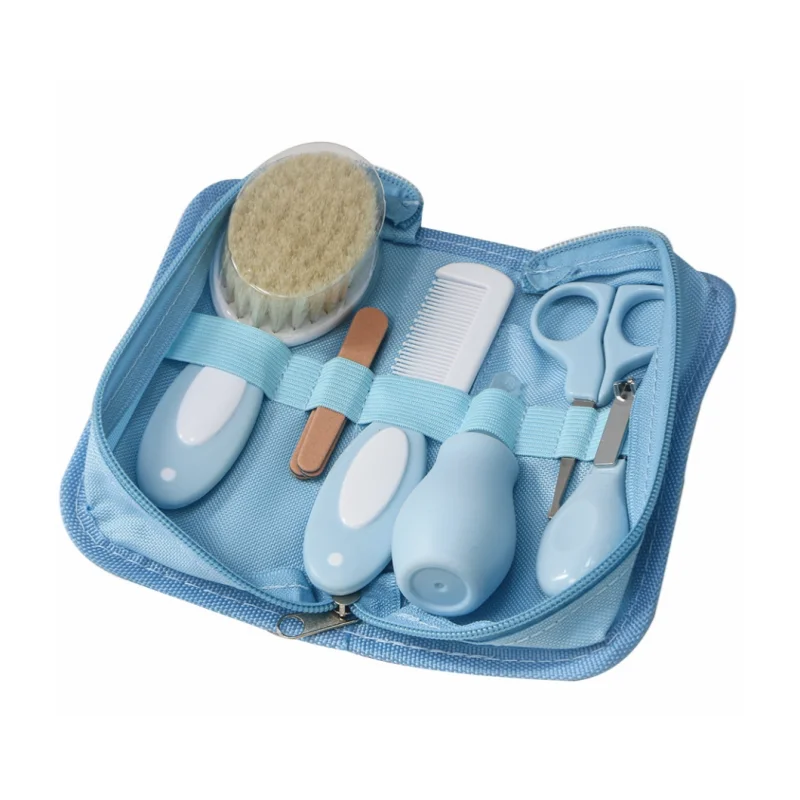 6-in-1 baby grooming set with nail clipper, scissors, brush, comb, nasal inhaler, and nail file in a blue travel case, safe for infants.
