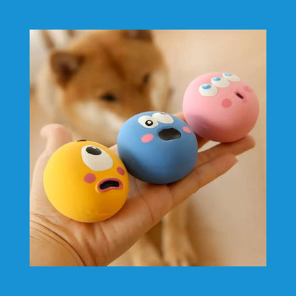 Hand holding three Squeaky Eyeball Dog Toy balls in yellow, blue, and pink; perfect for engaging dog playtime and reducing boredom.