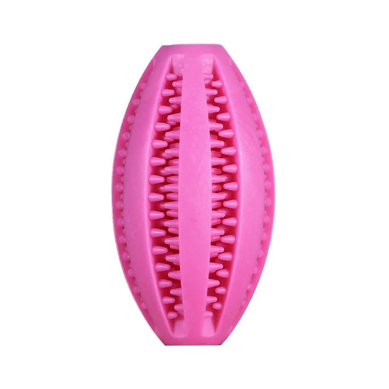 Pink natural rubber chew ball for dogs; cleans teeth, holds treats, and great for fetch. Durable and non-toxic.