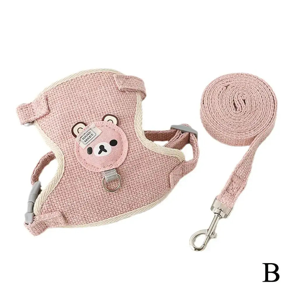 Pink undershirt-style pet harness with animal design, featuring breathable material and adjustable leash for small pets.