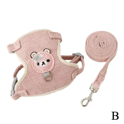 Pink undershirt-style pet harness with animal design, featuring breathable material and adjustable leash for small pets.